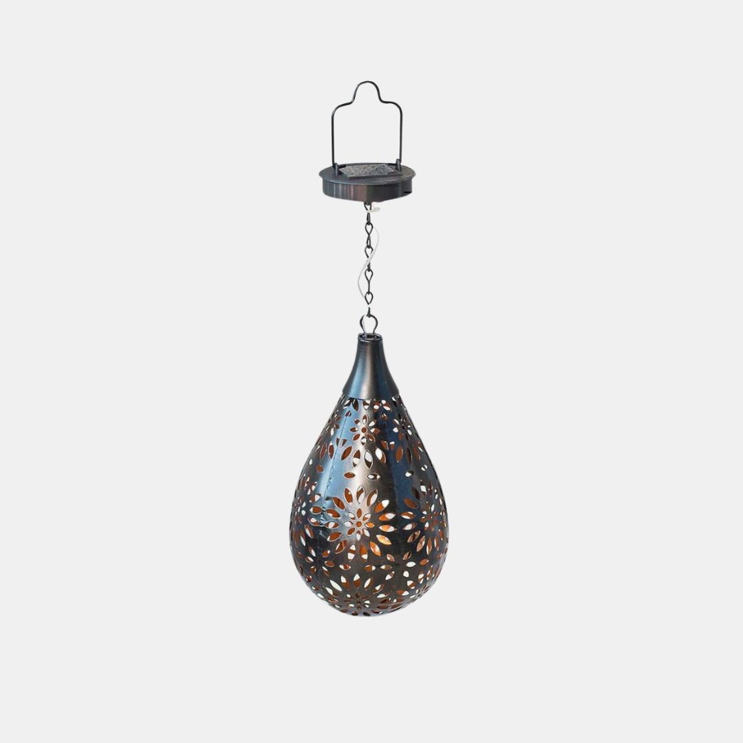Decorative hanging lantern with cut-out patterns on a white background